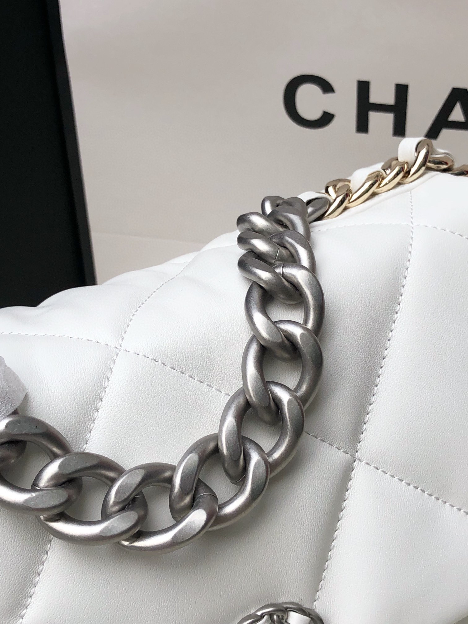 Ch*el 19 large handbag shiny leather, gold-tone, silver-tone & ruthenium-finish metal white 7.8 × 11.7 × 3.9 in