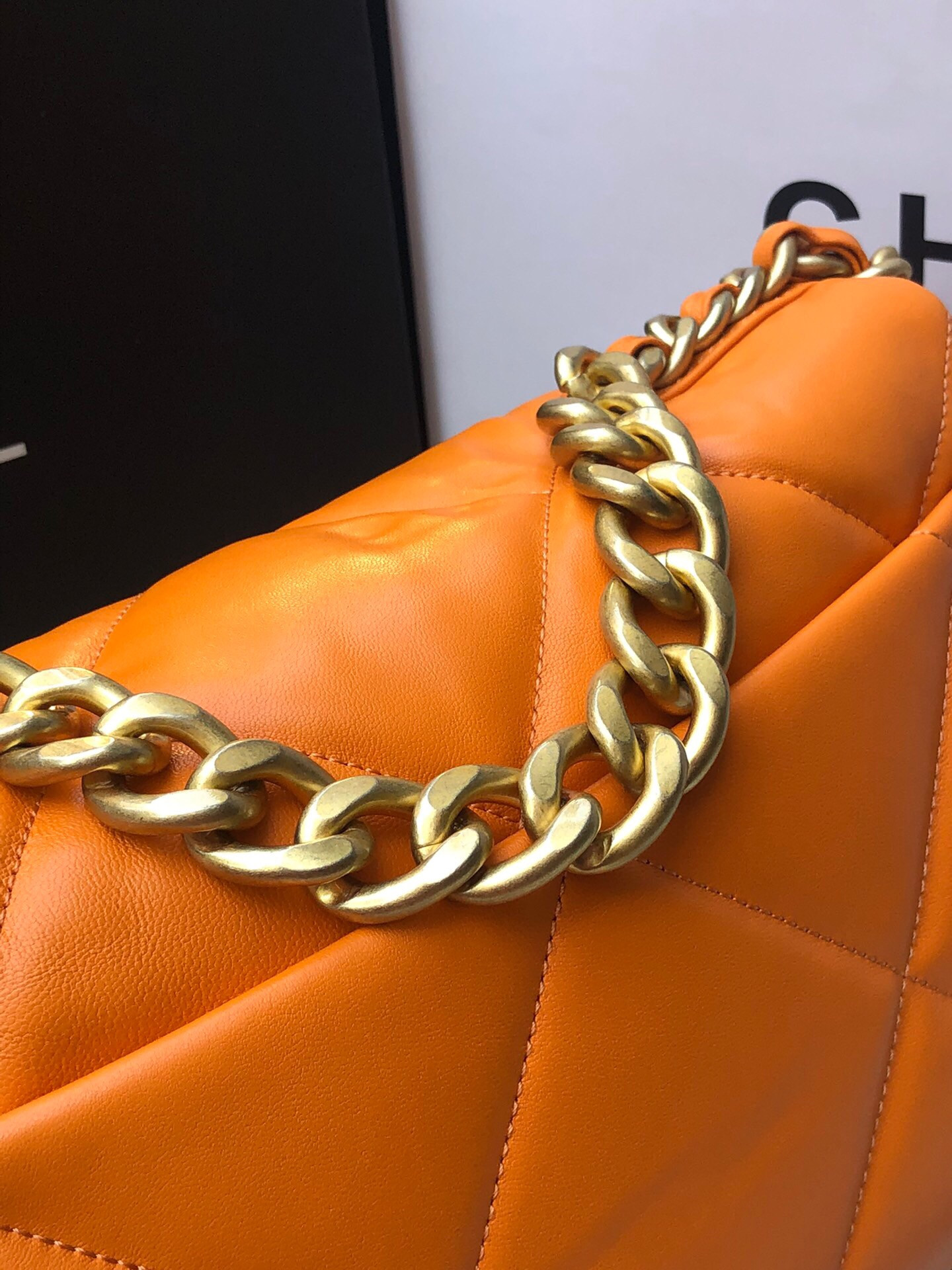 Ch*el 19 large handbag shiny leather, gold-tone, silver-tone & ruthenium-finish metal orange 7.8 × 11.7 × 3.9 in