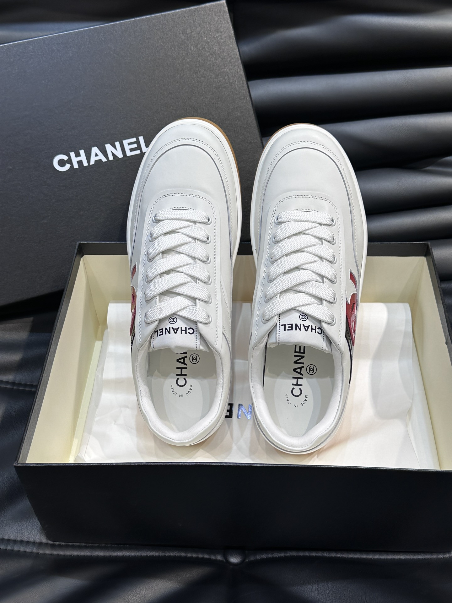 ua Ch*el sneaker calfskin