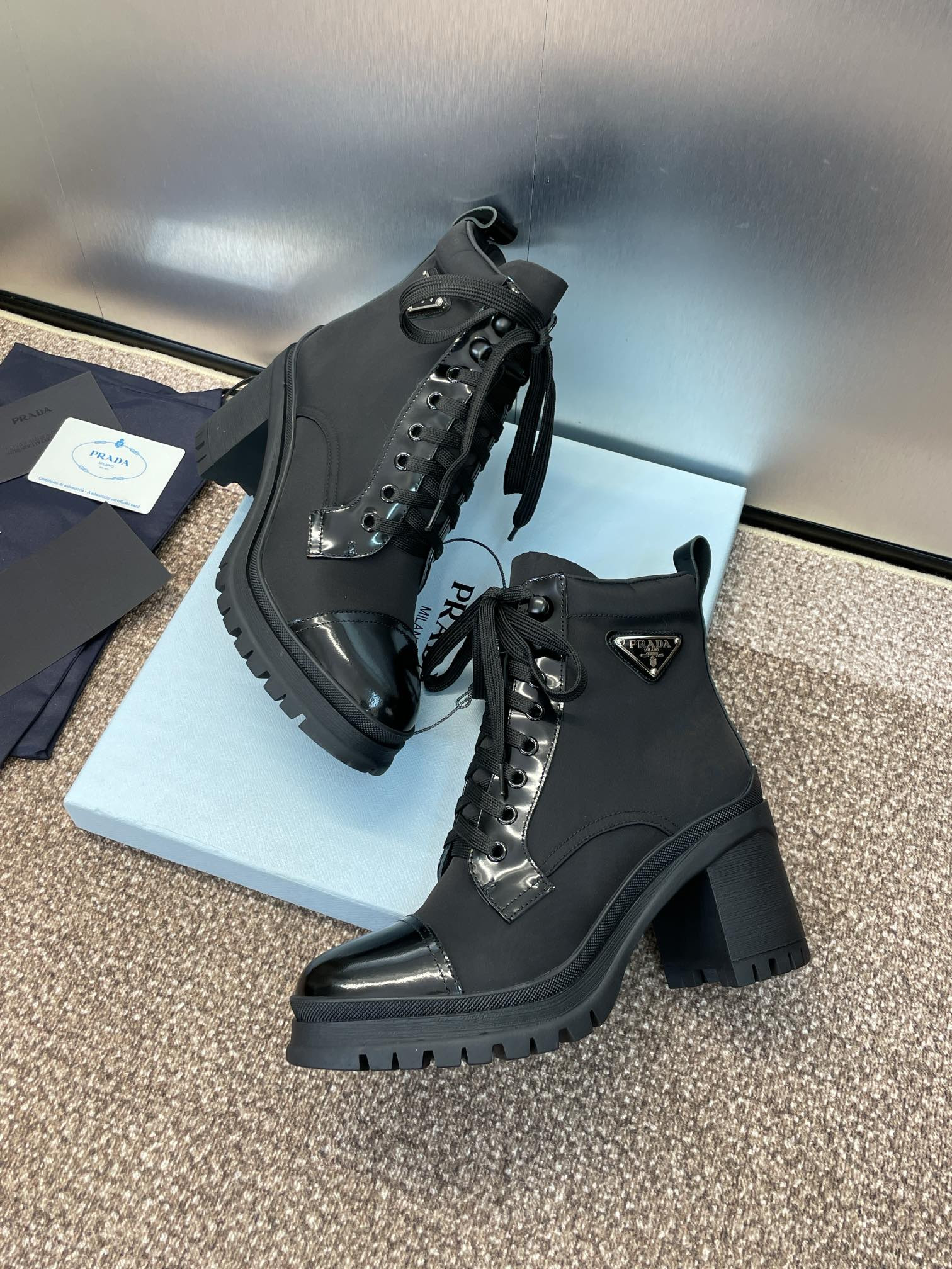 ua Pra*a re-nylon and leather booties