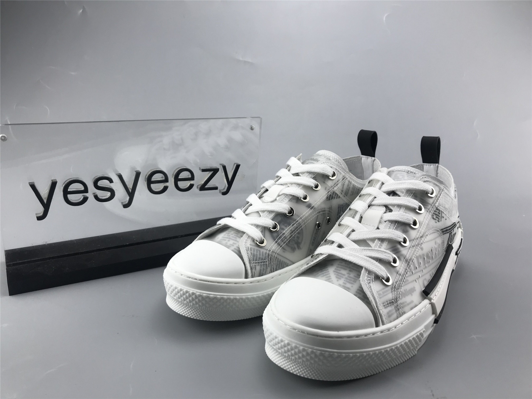 ua D10r b23 low top daniel asham newspaper