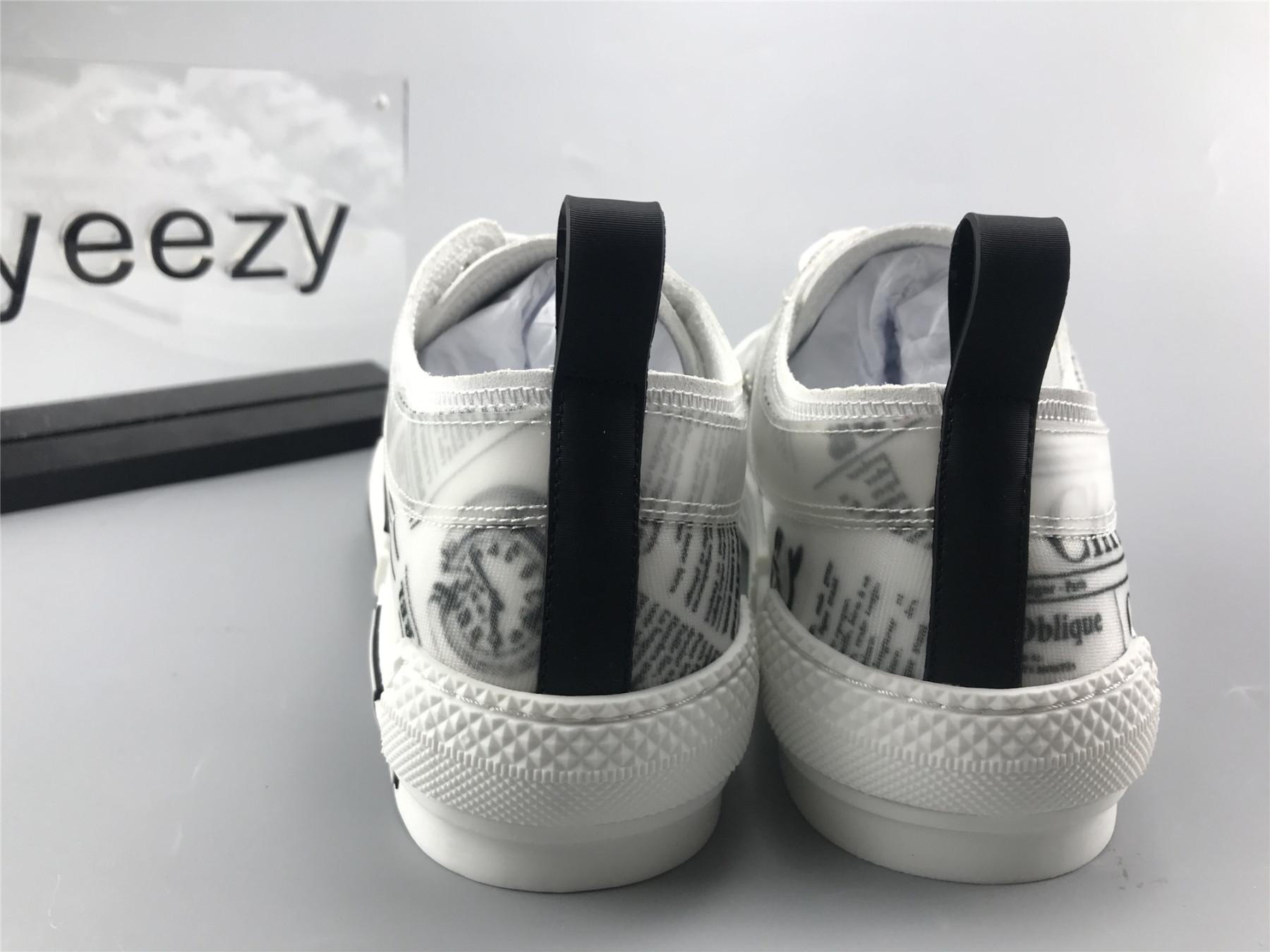 ua D10r b23 low top daniel asham newspaper