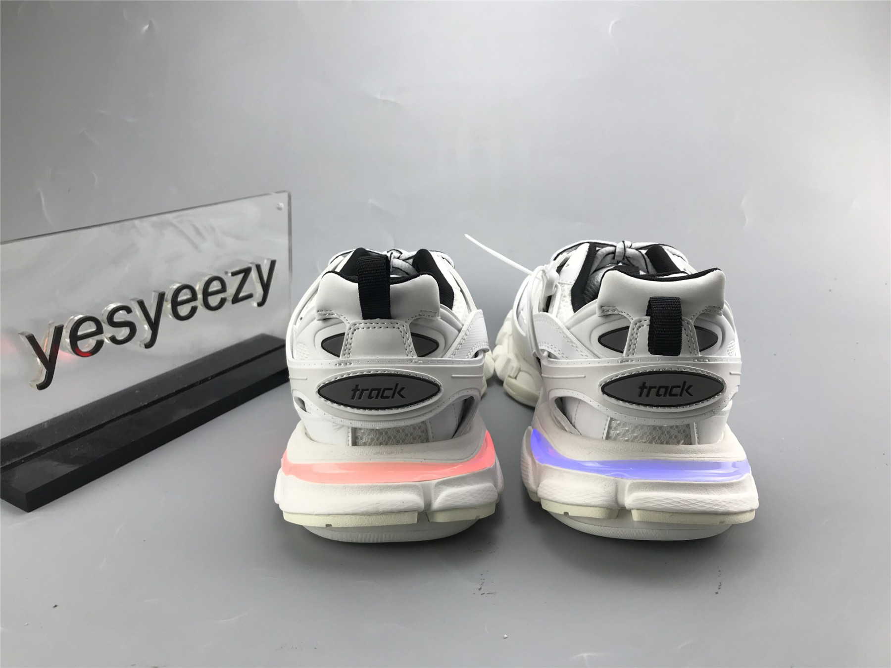UA TRACK TRAINER WHITE BLACK WITH LED LIGHTS