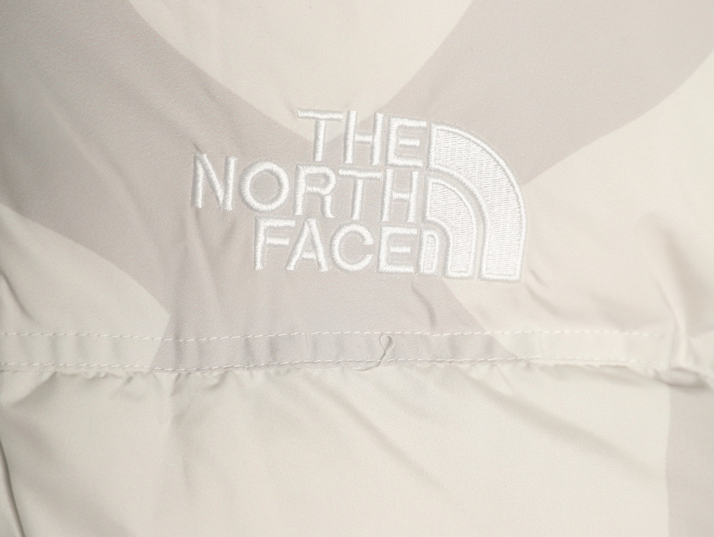 the n0r*h Fa*e x kaws short puffer jacket