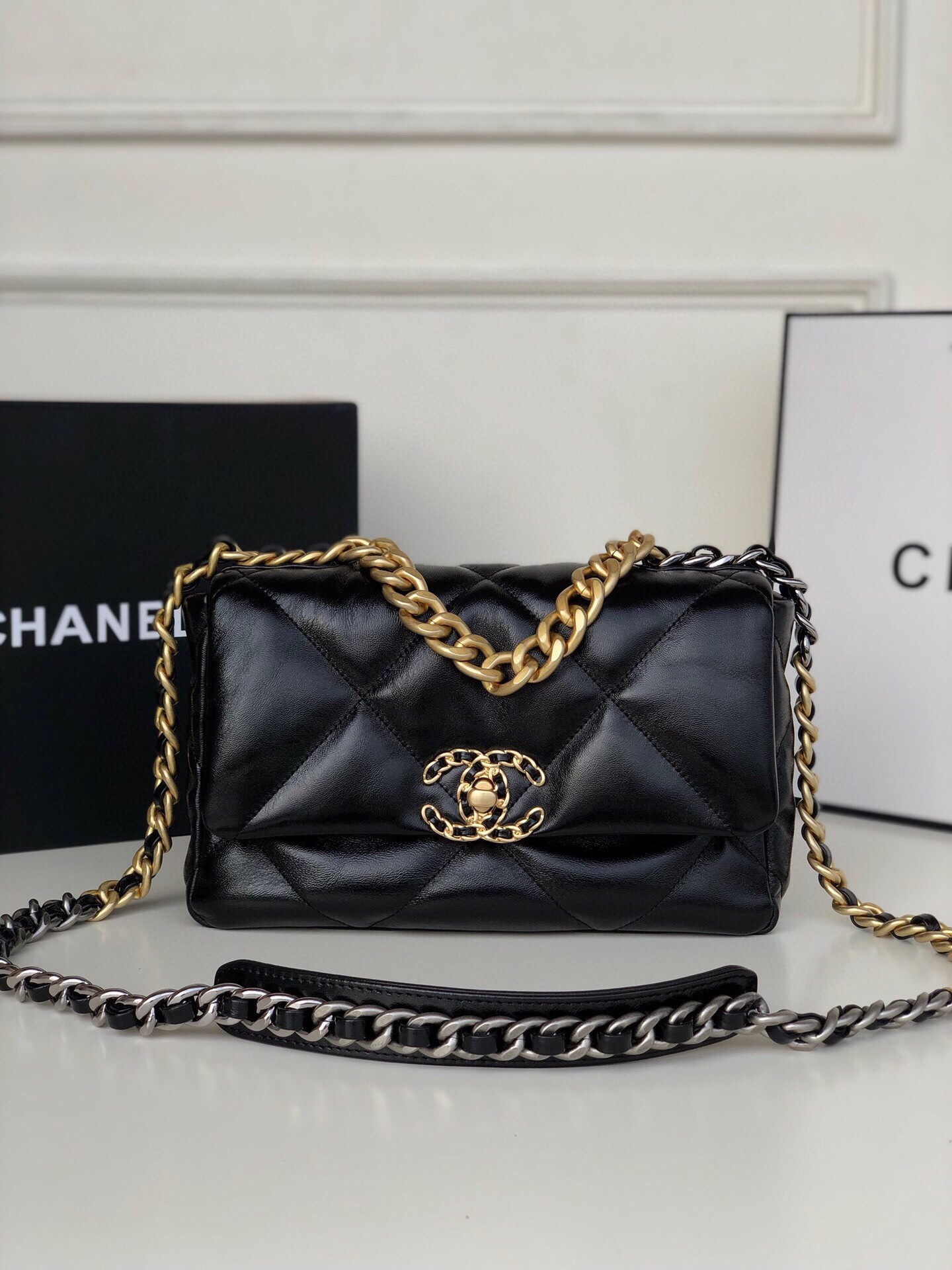 Ch**el 19 HANDBAG Shiny Leather, Gold-Tone, Silver-Tone & Ruthenium-Finish Metal Black 6.2 × 10.1 × 3.5 in